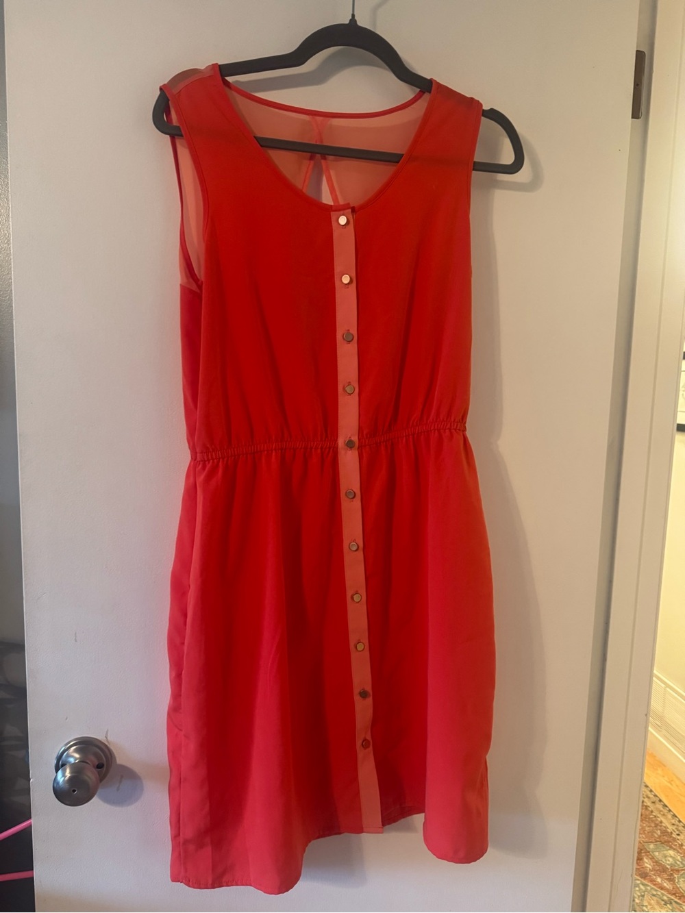 Labelled orange women's top neckline